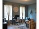 Well-lit home office with a desk, chair, and decorative accents at 32618 Rapids Loop, Wesley Chapel, FL 33545