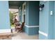 Inviting porch with a cozy seating area to enjoy outdoor living at 32618 Rapids Loop, Wesley Chapel, FL 33545