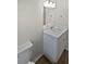 Bathroom featuring a toilet and vanity with solid surface top at 38832 Henry Dr, Zephyrhills, FL 33542