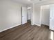 Bedroom featuring luxury vinyl plank flooring and a double door closet at 38832 Henry Dr, Zephyrhills, FL 33542