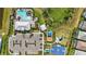 Aerial view of community amenities, including a pool, clubhouse, playground, and parking at 16231 Pine Mist Dr, Bradenton, FL 34211