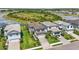 Aerial view of beautiful homes, featuring lush landscaping, a serene lake, and inviting green spaces in the community at 16231 Pine Mist Dr, Bradenton, FL 34211