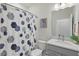 Cozy bathroom featuring a shower with a patterned curtain, a vanity with cabinet, and clean design at 16231 Pine Mist Dr, Bradenton, FL 34211