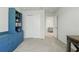 Spacious bedroom with carpeted floors, closet, and view into adjacent living area at 16231 Pine Mist Dr, Bradenton, FL 34211