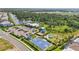 Community amenities include resort-style pool, playground, basketball court, parking, and lake views in a lush setting at 16231 Pine Mist Dr, Bradenton, FL 34211