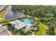 An aerial shot of a resort-style pool with lush landscaping and ample seating at 16231 Pine Mist Dr, Bradenton, FL 34211