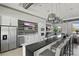 Clubhouse kitchen featuring stainless steel appliances, quartz countertop and bar seating at 16231 Pine Mist Dr, Bradenton, FL 34211