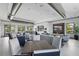 Open-concept clubhouse with a living room, kitchen and dining area for community gatherings at 16231 Pine Mist Dr, Bradenton, FL 34211