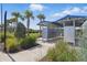 Community mailboxes are surrounded by palm trees and greenery, offering convenience and curb appeal at 16231 Pine Mist Dr, Bradenton, FL 34211
