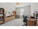 Office space with a large desk, storage shelves, and comfortable chair by the window at 16231 Pine Mist Dr, Bradenton, FL 34211