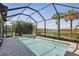 Inviting screened-in pool and spa, perfect for relaxation and enjoying the Florida sunshine at 16231 Pine Mist Dr, Bradenton, FL 34211