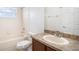 Well-lit bathroom featuring a vanity with solid surface countertop, toilet, mirror and shower-tub combo at 3319 Thistledown Ln, Land O Lakes, FL 34638