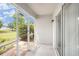 This porch features a screen to keep the bugs out and allows you to enjoy the outdoors at 3319 Thistledown Ln, Land O Lakes, FL 34638