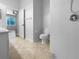 Bathroom with a toilet and a shower featuring white tile walls at 6370 Sturbridge Ct, Sarasota, FL 34238