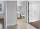Bright bathroom featuring a white toilet, shower, and a neutral tile floor at 6370 Sturbridge Ct, Sarasota, FL 34238