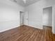 Bedroom featuring wood floors, a walk-in closet, and access to the bathroom at 6370 Sturbridge Ct, Sarasota, FL 34238