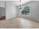 Dining room with tile floors, a large window, and a modern chandelier at 6370 Sturbridge Ct, Sarasota, FL 34238