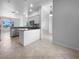 Open concept kitchen featuring stainless appliances, granite counters, and breakfast bar at 6370 Sturbridge Ct, Sarasota, FL 34238