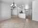 Open-concept kitchen with tiled floors, granite countertops, and modern appliances at 6370 Sturbridge Ct, Sarasota, FL 34238