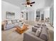 Bright living room with neutral tones and natural light, perfect for relaxing or entertaining guests at 6370 Sturbridge Ct, Sarasota, FL 34238