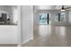 Open-concept living space with tile floors and plenty of natural light from the backyard and pool at 6370 Sturbridge Ct, Sarasota, FL 34238