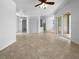 Open-concept living room with tiled floors and access to the outdoor area at 6370 Sturbridge Ct, Sarasota, FL 34238