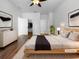 Cozy main bedroom features contemporary decor, a walk-in closet and minimalist design at 6370 Sturbridge Ct, Sarasota, FL 34238