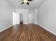 Hardwood floors enhance a room with closet, an ensuite bathroom, and a ceiling fan at 6370 Sturbridge Ct, Sarasota, FL 34238