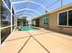 A screened-in pool area has a pool, patio, and outdoor space perfect for relaxation at 6370 Sturbridge Ct, Sarasota, FL 34238