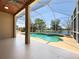 Beautiful screened-in pool and lanai with peaceful lake view at 6370 Sturbridge Ct, Sarasota, FL 34238