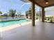 Screened lanai with a pool overlooking a serene lake at 6370 Sturbridge Ct, Sarasota, FL 34238