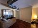 Bedroom features hardwood flooring and dresser at 10709 Dowry Ave, Tampa, FL 33615