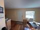 Bright living area featuring hardwood floors and an exterior door at 10709 Dowry Ave, Tampa, FL 33615