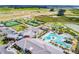 An aerial view of the community featuring tennis courts, pool and residential homes at 31840 Magna Gulf Loop, San Antonio, FL 33576