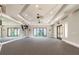 Amenity room with mirrors, neutral walls, and covered patio access at 31840 Magna Gulf Loop, San Antonio, FL 33576