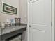Close-up of a stylish mini-bar featuring granite countertops and a beverage cooler at 31840 Magna Gulf Loop, San Antonio, FL 33576