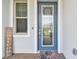Stylish front door with decorative glass and a welcome mat, creating an inviting and elegant entrance to the home at 31840 Magna Gulf Loop, San Antonio, FL 33576