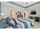 Spacious main bedroom with a beautifully decorated bed, comfortable furnishings, and an open layout at 31840 Magna Gulf Loop, San Antonio, FL 33576