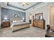 Large main bedroom featuring a luxurious bed, stylish decor, and plenty of natural light from the large windows at 31840 Magna Gulf Loop, San Antonio, FL 33576