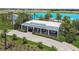 A charming Welcome Center surrounded by lush landscaping, welcoming all to the community at 31840 Magna Gulf Loop, San Antonio, FL 33576