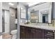 Bathroom featuring granite countertops, dark wood cabinets, and modern fixtures at 3221 White Ibis Ct # C1, Punta Gorda, FL 33950
