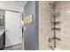 Bright bathroom shower stall with tile walls, and convenient shelving at 3221 White Ibis Ct # C1, Punta Gorda, FL 33950