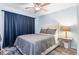 Cozy bedroom with a comfortable bed, soft lighting, and wood-look floors at 3221 White Ibis Ct # C1, Punta Gorda, FL 33950