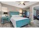 Bedroom with a view of the private balcony, featuring a tranquil design and wood-look flooring at 3221 White Ibis Ct # C1, Punta Gorda, FL 33950