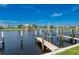 Community boat dock along waterway with boat slips on a sunny day at 3221 White Ibis Ct # C1, Punta Gorda, FL 33950