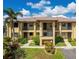 Well-maintained two story condo building with landscaped front yard and covered entryways and balconies at 3221 White Ibis Ct # C1, Punta Gorda, FL 33950