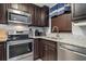 Modern kitchen with stainless steel appliances and granite countertops at 3221 White Ibis Ct # C1, Punta Gorda, FL 33950