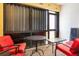 Relaxing lanai featuring a small seating area with red chairs at 3221 White Ibis Ct # C1, Punta Gorda, FL 33950