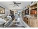 Cozy living room seamlessly connected to dining area and kitchen, featuring open floor plan and wood-look flooring at 3221 White Ibis Ct # C1, Punta Gorda, FL 33950