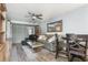 Comfortable living room featuring modern furniture, a ceiling fan, and wood-look flooring at 3221 White Ibis Ct # C1, Punta Gorda, FL 33950